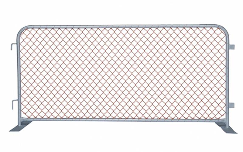 A piece of construction barrier with two flat metal feet on white background.